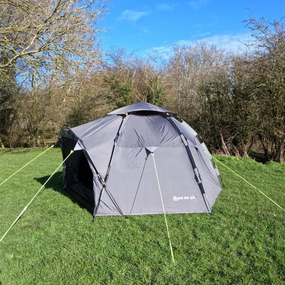 Side view of LocTek Igloo MK3 Fast Pitch Tent - 3 Man Tent Khyam with open front on grassy campsite, sunny day.